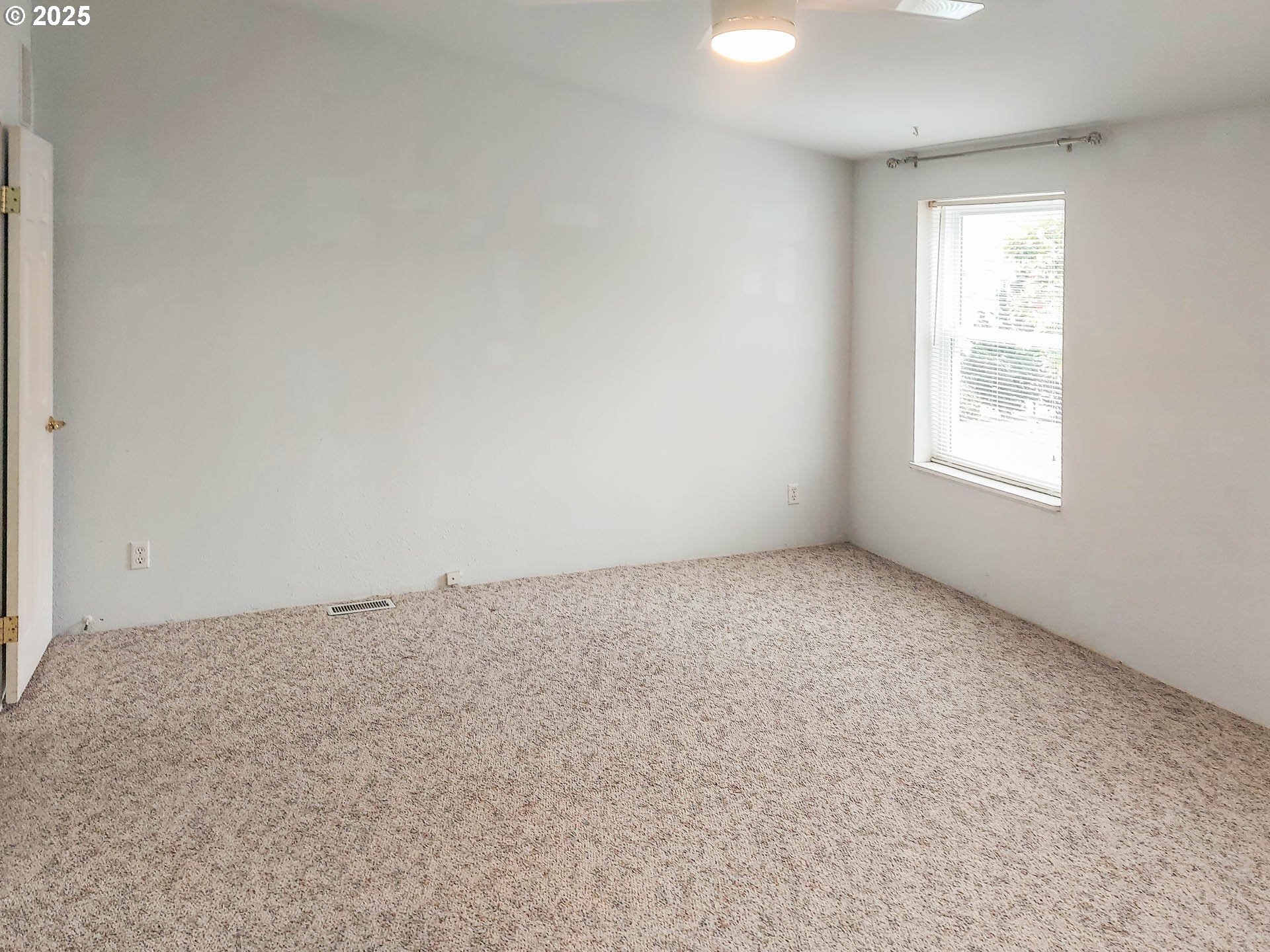 210 Northwest Timothy Avenue Winston, OR 97496 - Photo 14 of 38 an empty room with a window