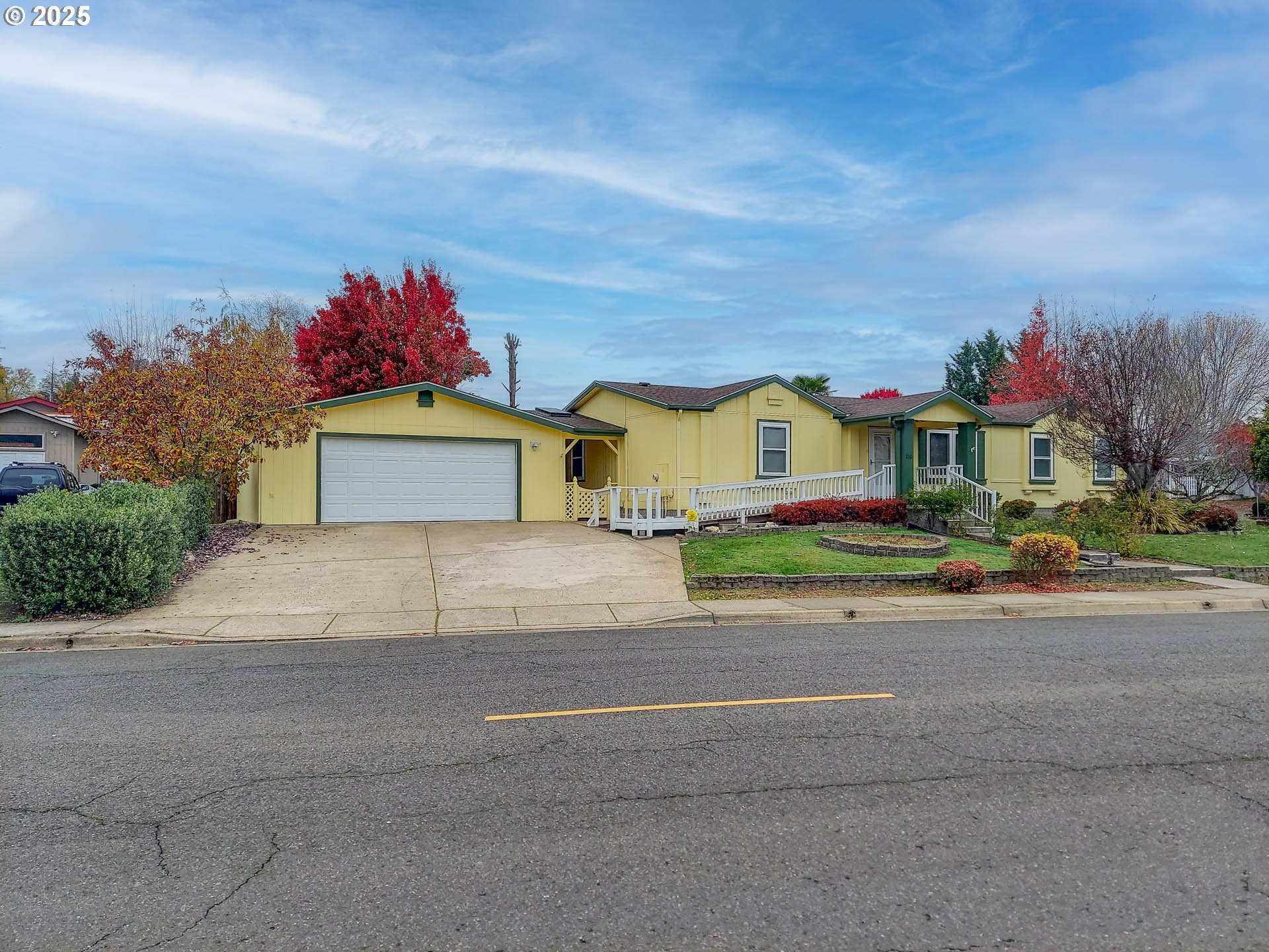 210 Northwest Timothy Avenue Winston, OR 97496 - Photo 2 of 38 a front view of a house with a yard and table and chairs
