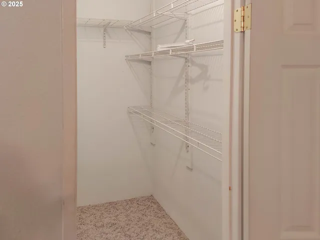 a bathroom with a granite countertop sink a mirror and a bathtub