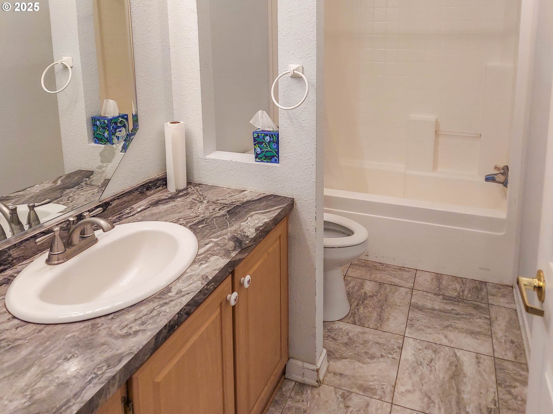 210 Northwest Timothy Avenue Winston, OR 97496 - Photo 22 of 38 a bathroom with a granite countertop sink a mirror and a bathtub