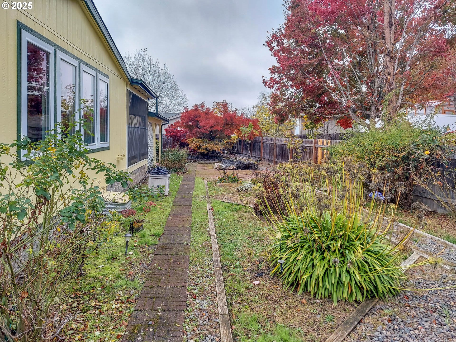 210 Northwest Timothy Avenue Winston, OR 97496 - Photo 31 of 38 a view of a house with a yard and garden