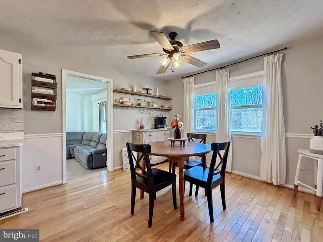 a kitchen with stainless steel appliances a refrigerator sink and cabinets
