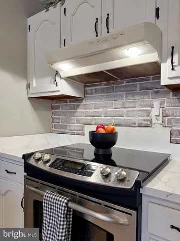a living room with furniture fireplace and flat screen tv