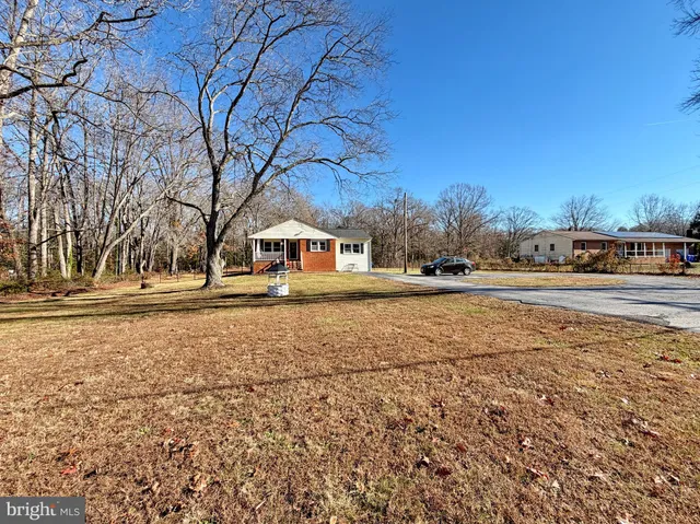 a view of a house with a snow in the yard