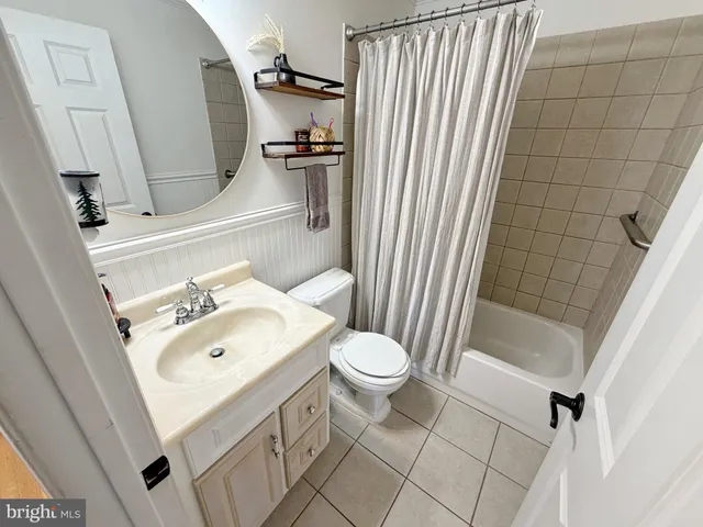 a bedroom with bed and a window