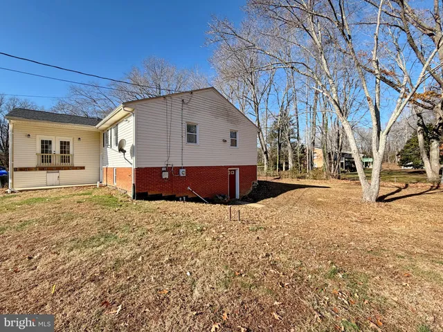 a backyard of a house with trees