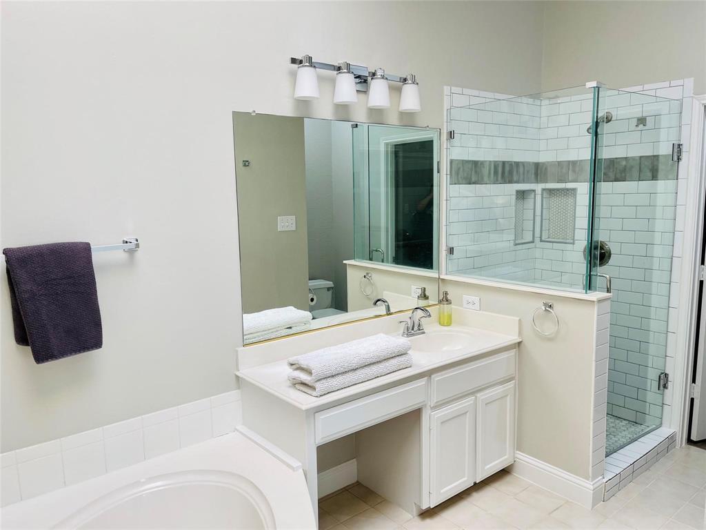 7848 Lancelot Road Frisco, TX 75035 - Photo 20 of 27 a bathroom with a sink and a mirror