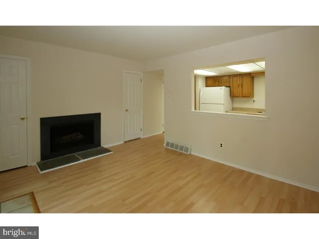 a room with a bed and a fireplace