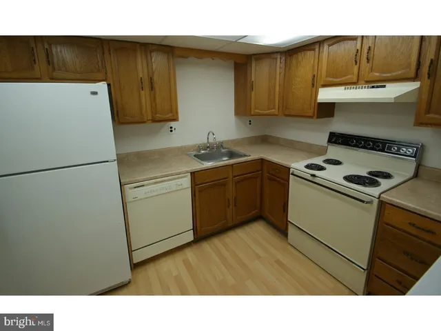 a kitchen with a cabinets and appliances