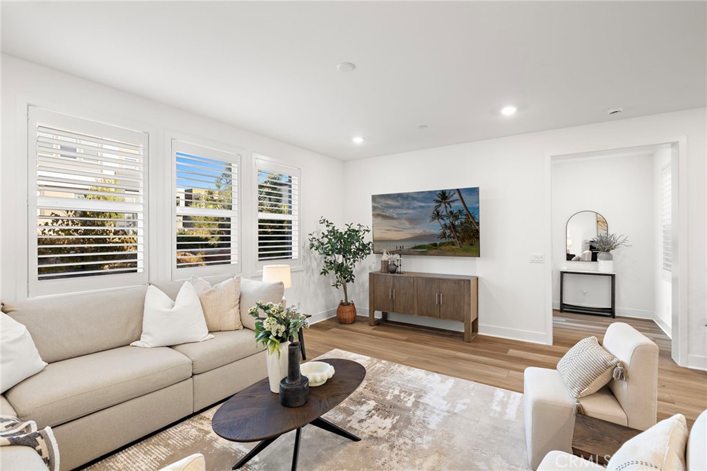 312 Merit Irvine, CA 92618 - Photo 11 of 46 a living room with furniture a window and a flat screen tv