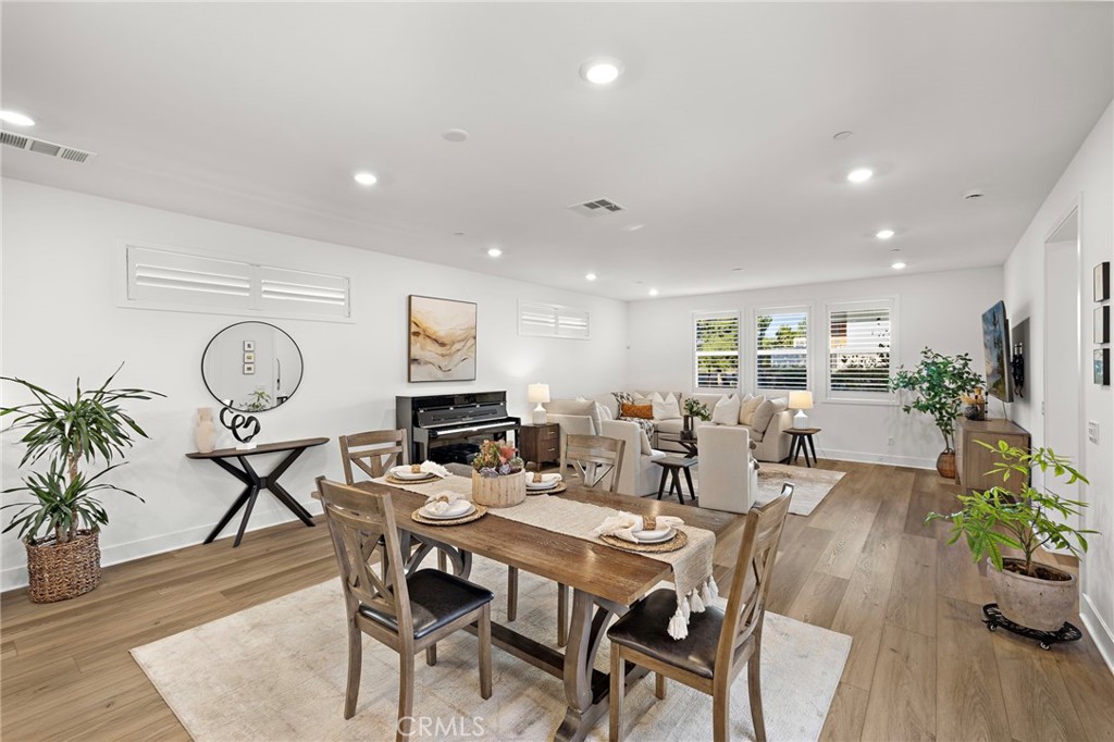 312 Merit Irvine, CA 92618 - Photo 13 of 46 a view of a dining room with furniture window and wooden floor
