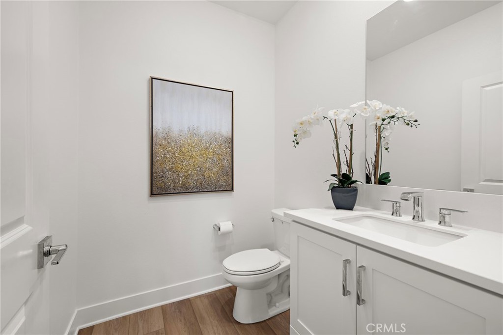 312 Merit Irvine, CA 92618 - Photo 14 of 46 a bathroom with a toilet a sink and mirror