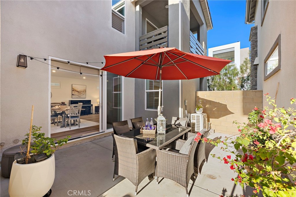 312 Merit Irvine, CA 92618 - Photo 16 of 46 a view of a patio with chairs and potted plants