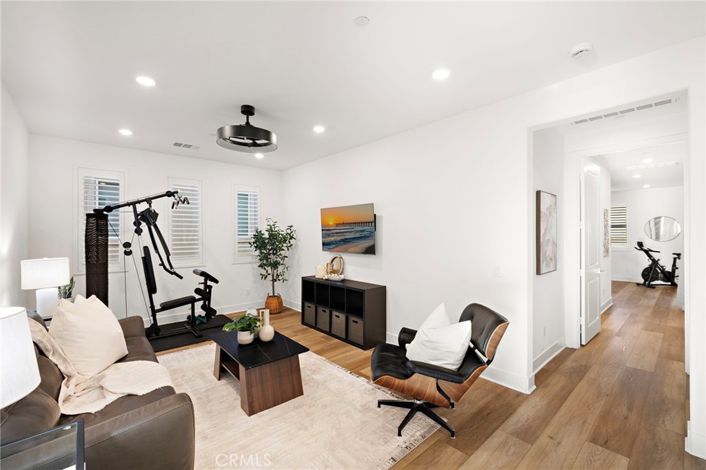 312 Merit Irvine, CA 92618 - Photo 18 of 46 a living room with furniture and wooden floor