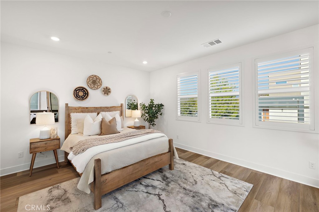 312 Merit Irvine, CA 92618 - Photo 19 of 46 a bedroom with a bed and a large window