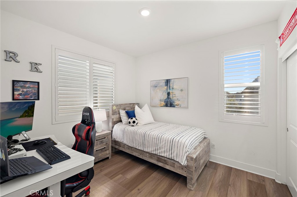 312 Merit Irvine, CA 92618 - Photo 26 of 46 a bedroom with a bed and a window