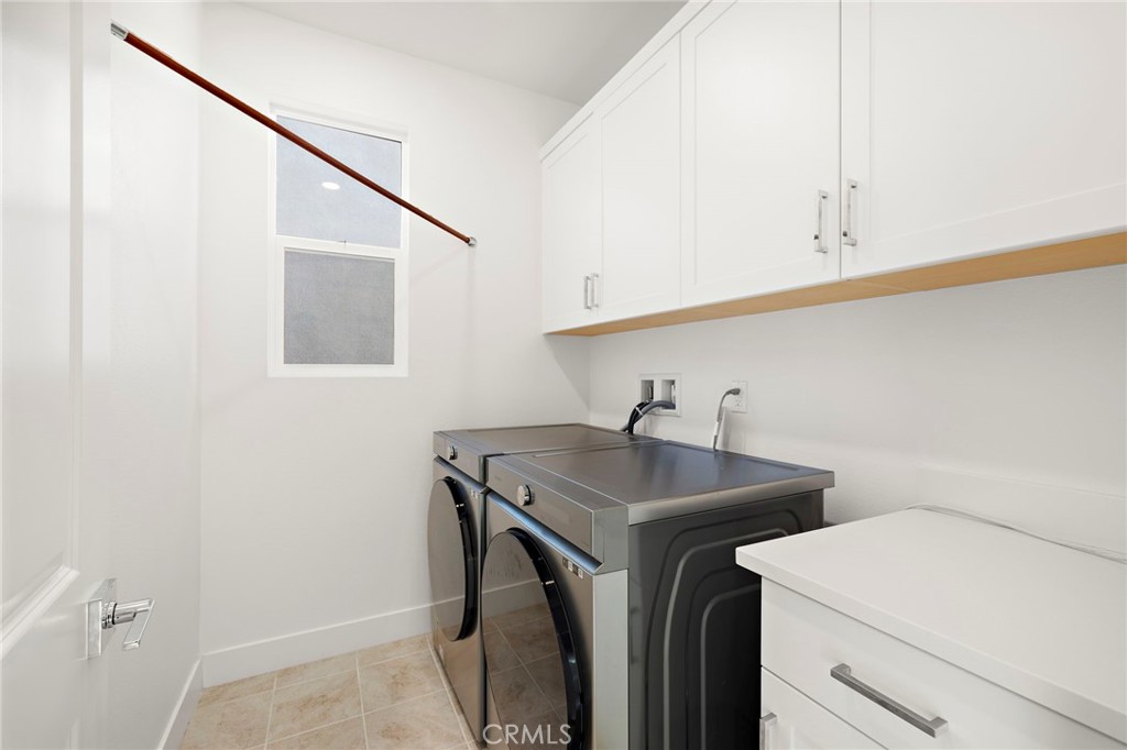 312 Merit Irvine, CA 92618 - Photo 28 of 46 a utility room with dryer and washer
