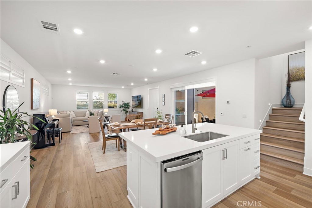 312 Merit Irvine, CA 92618 - Photo 7 of 46 a view of a living room and dining room