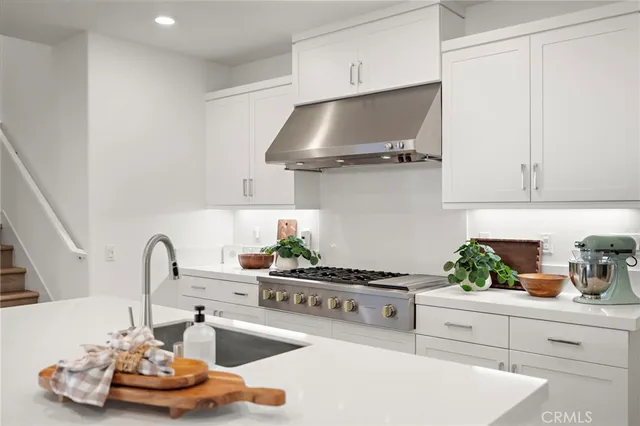 a dining room with lots of tables a large window and chairs