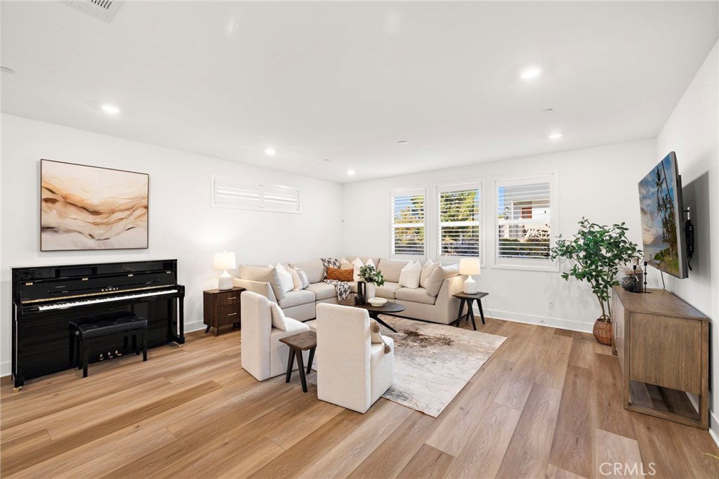 312 Merit Irvine, CA 92618 - Photo 10 of 46 a living room with furniture and a flat screen tv