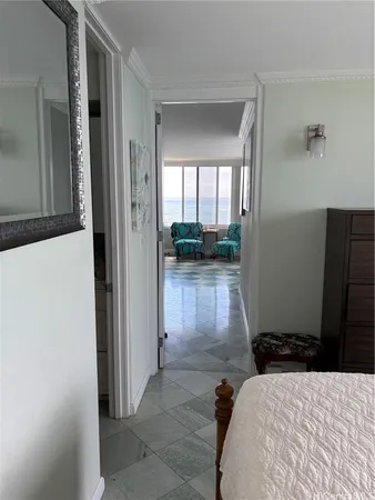 a bedroom with a bed and a view of bathroom