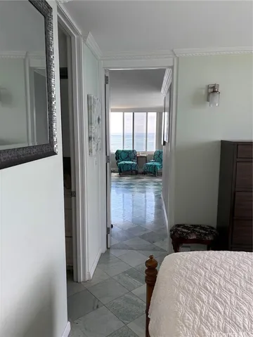 a bedroom with a bed and a view of bathroom