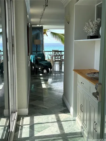 a hallway with view of living room