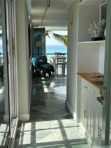 a hallway with view of living room