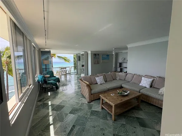 a living room with furniture and a large window