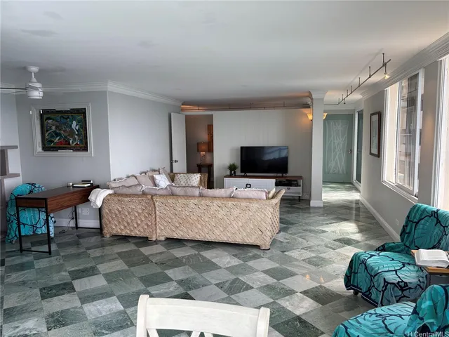 a living room with furniture and a flat screen tv