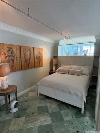 a bedroom with a bed and window