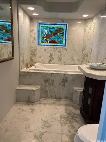 a bathroom with a sink and mirror