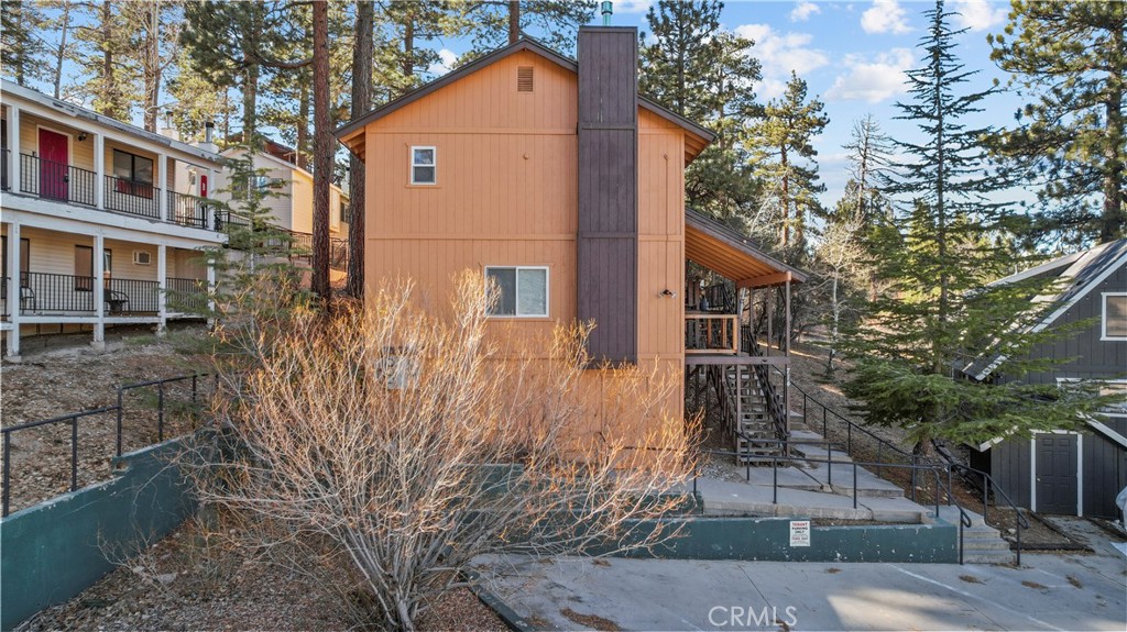 714 Paine Road Big Bear Lake, CA 92315 - Photo 11 of 39 a front view of a house with a yard and trees