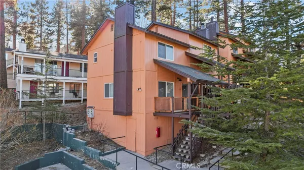 front view of a house with a tree