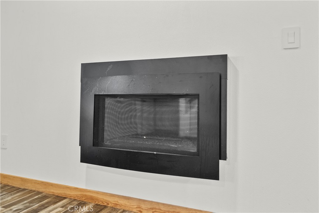 714 Paine Road Big Bear Lake, CA 92315 - Photo 28 of 39 a living room with a fireplace