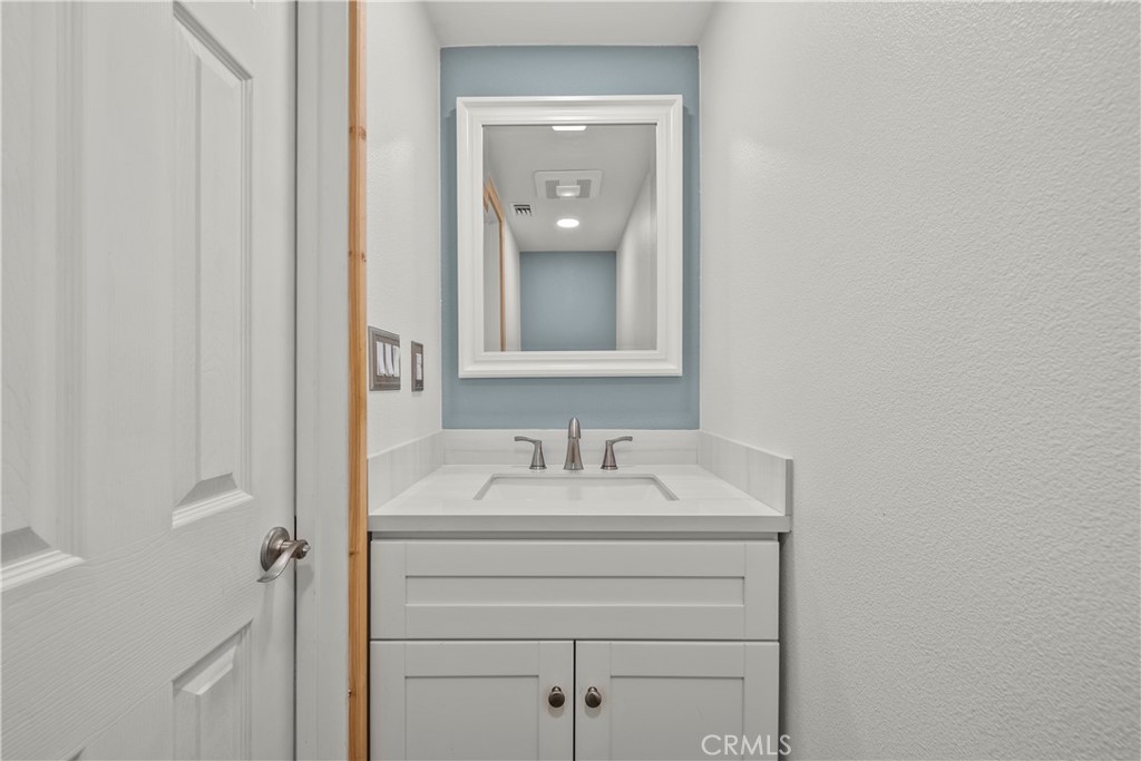 714 Paine Road Big Bear Lake, CA 92315 - Photo 29 of 39 a bathroom with a sink vanity and mirror