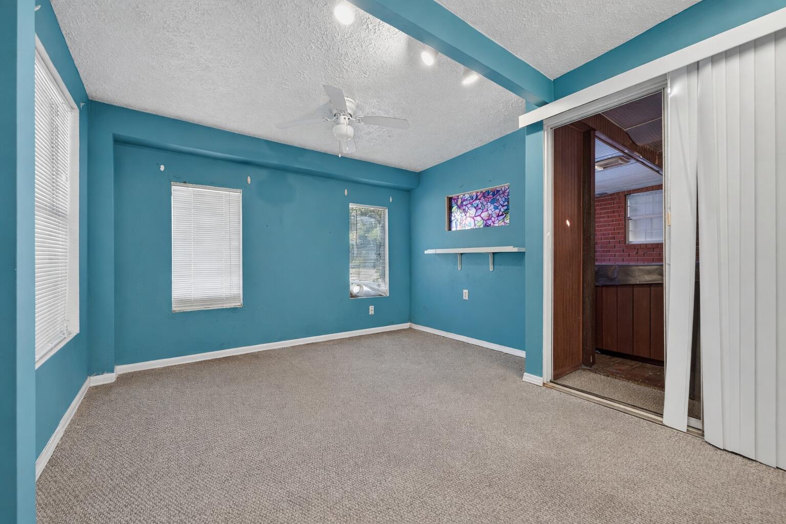 5688 Ridge Avenue Milton, FL 32583 - Photo 18 of 31 an empty room with windows and cabinet