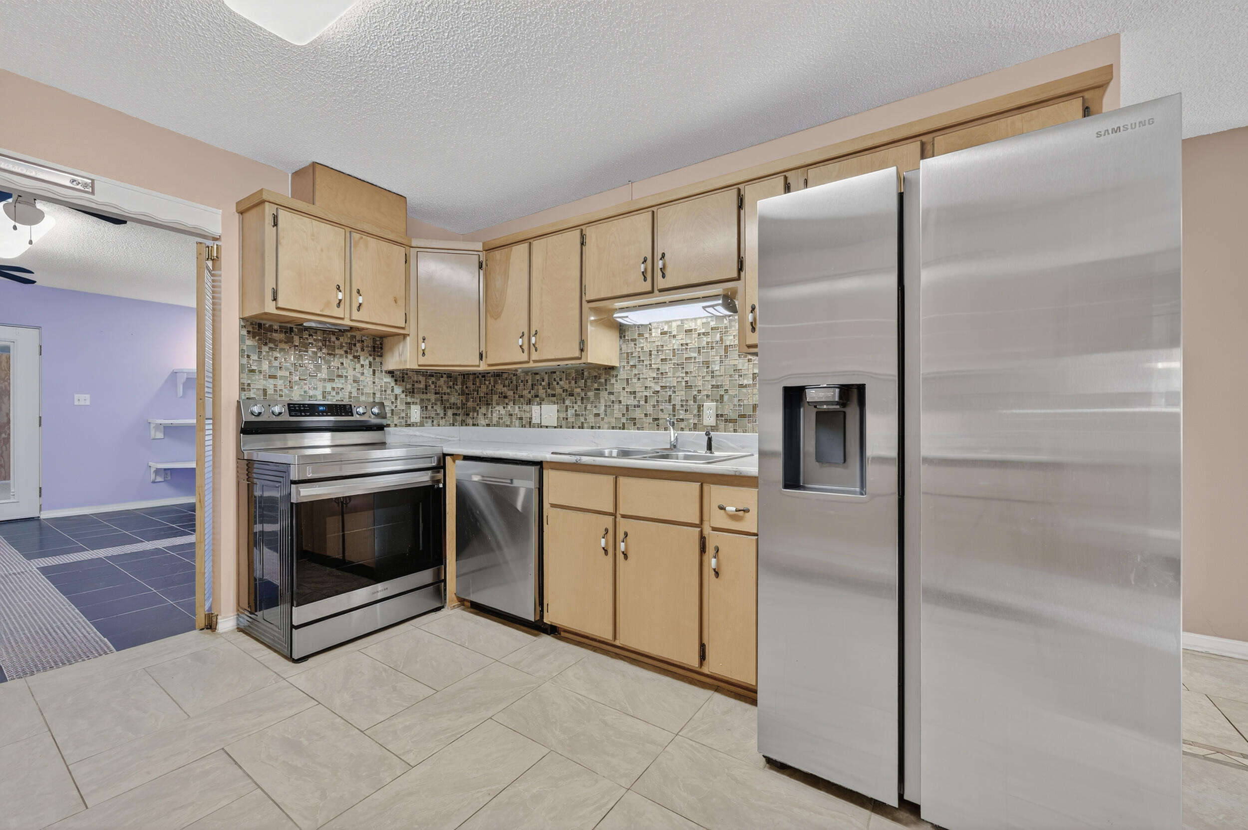 5688 Ridge Avenue Milton, FL 32583 - Photo 5 of 31 a kitchen with stainless steel appliances granite countertop a refrigerator and a stove