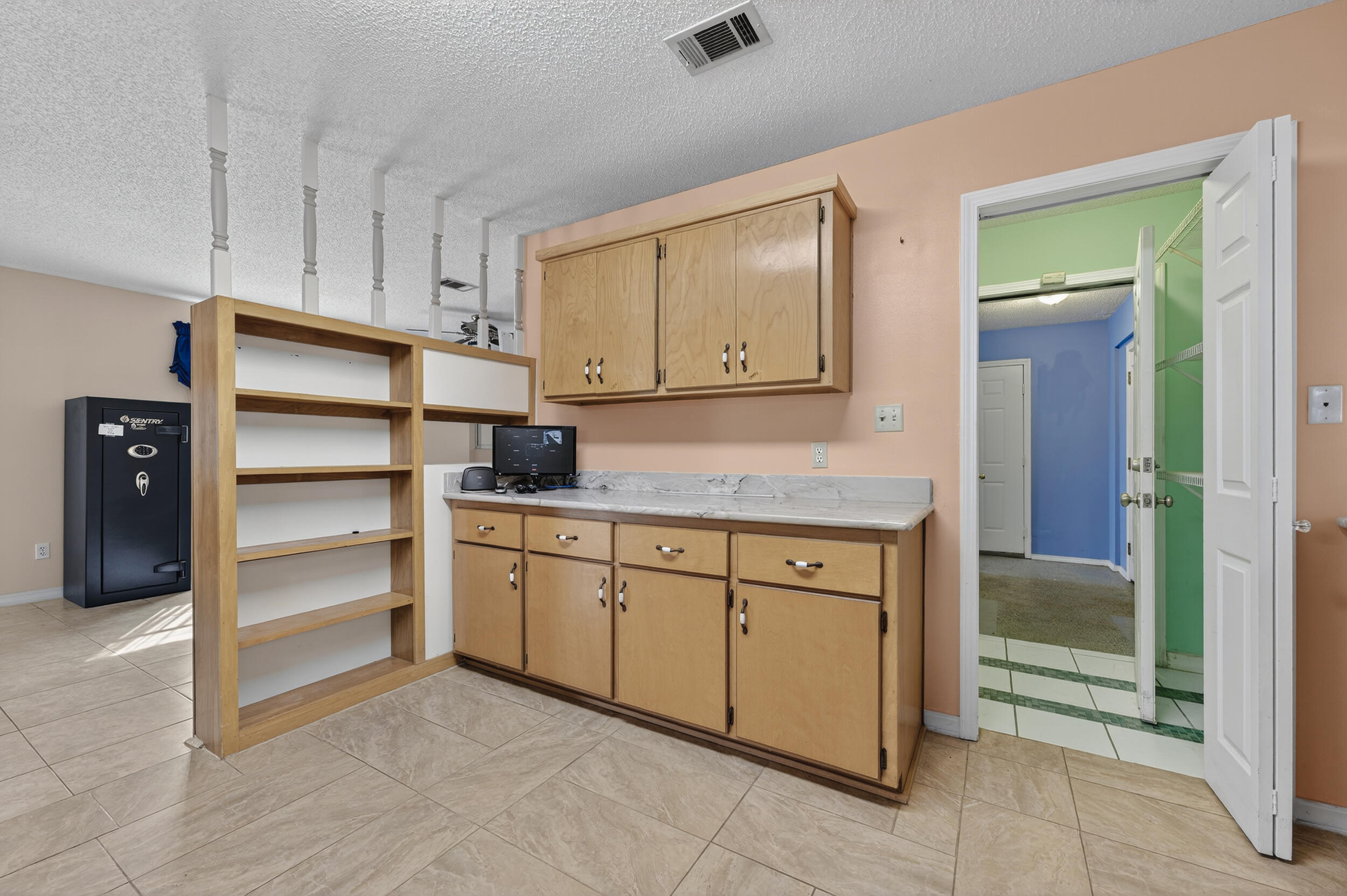 5688 Ridge Avenue Milton, FL 32583 - Photo 6 of 31 a kitchen with granite countertop cabinets and appliances