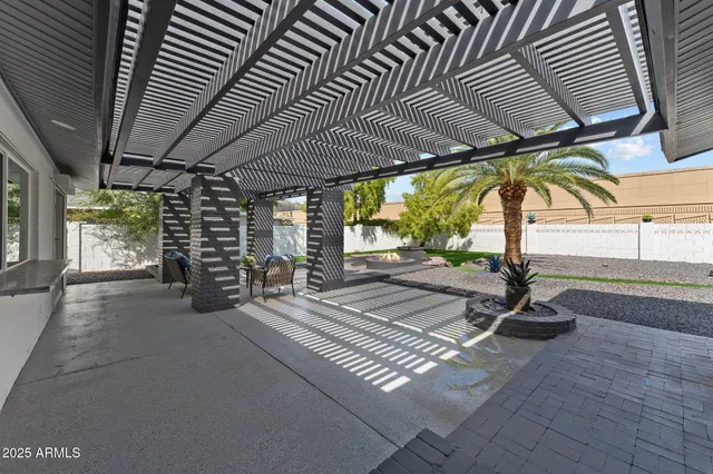 a view of swimming pool with outdoor seating