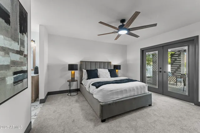 a view of a backyard with plants and outdoor seating