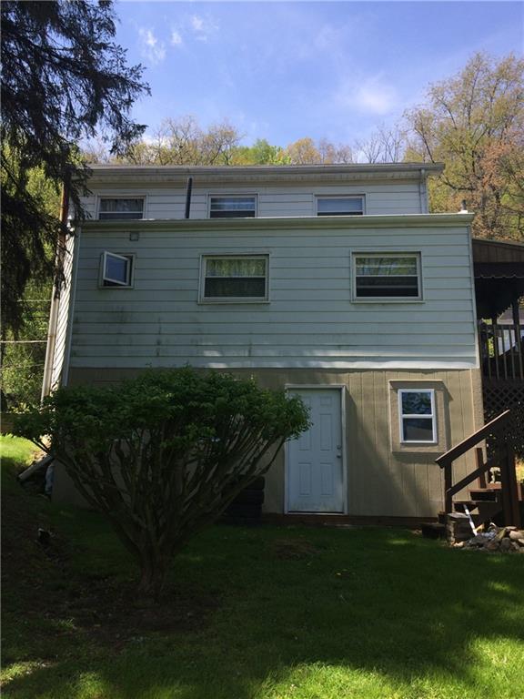1218 Sharon Road Beaver, PA 15009 - Photo 2 of 17 a front view of house with yard and trees