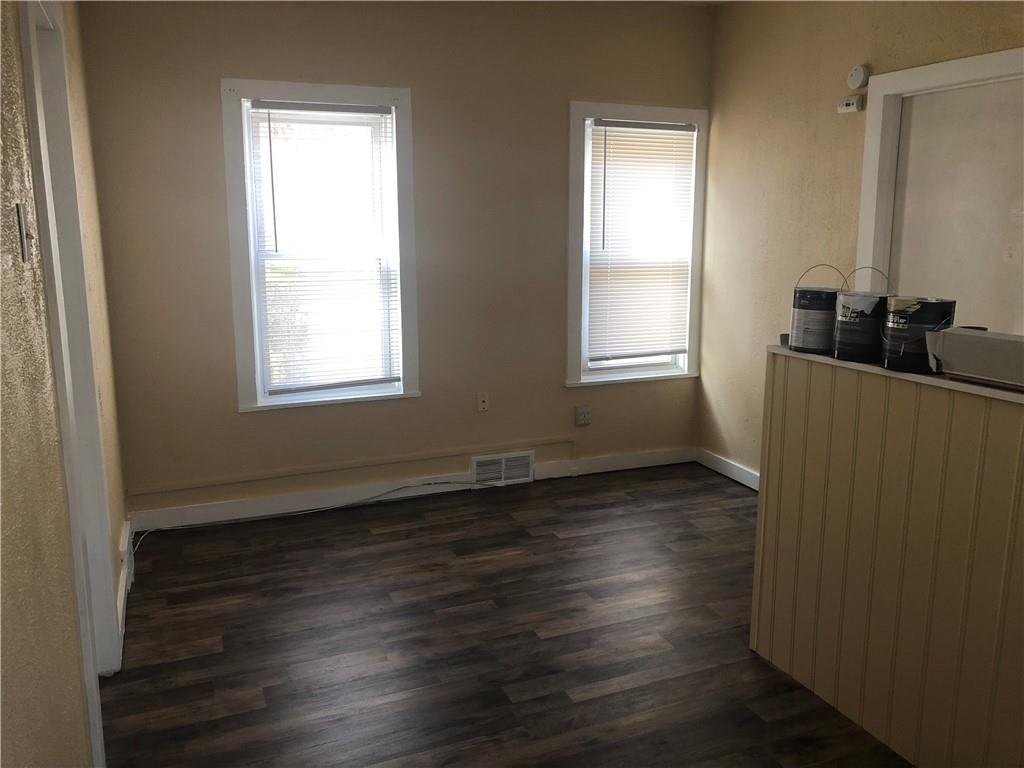 1218 Sharon Road Beaver, PA 15009 - Photo 13 of 17 an empty room with wooden floor and windows