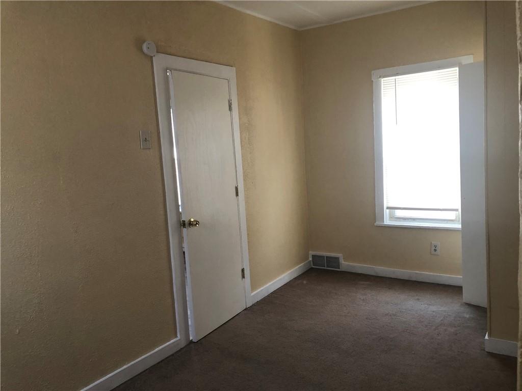 1218 Sharon Road Beaver, PA 15009 - Photo 15 of 17 an empty room that has a window