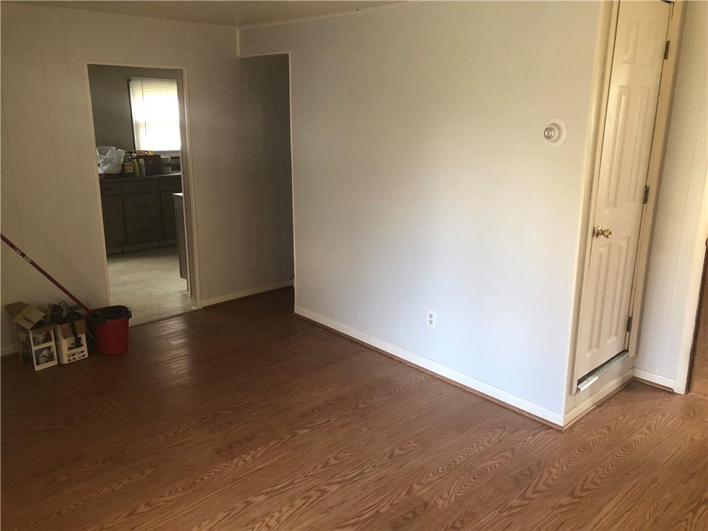 1218 Sharon Road Beaver, PA 15009 - Photo 5 of 17 a view of a livingroom with wooden floor and staircase