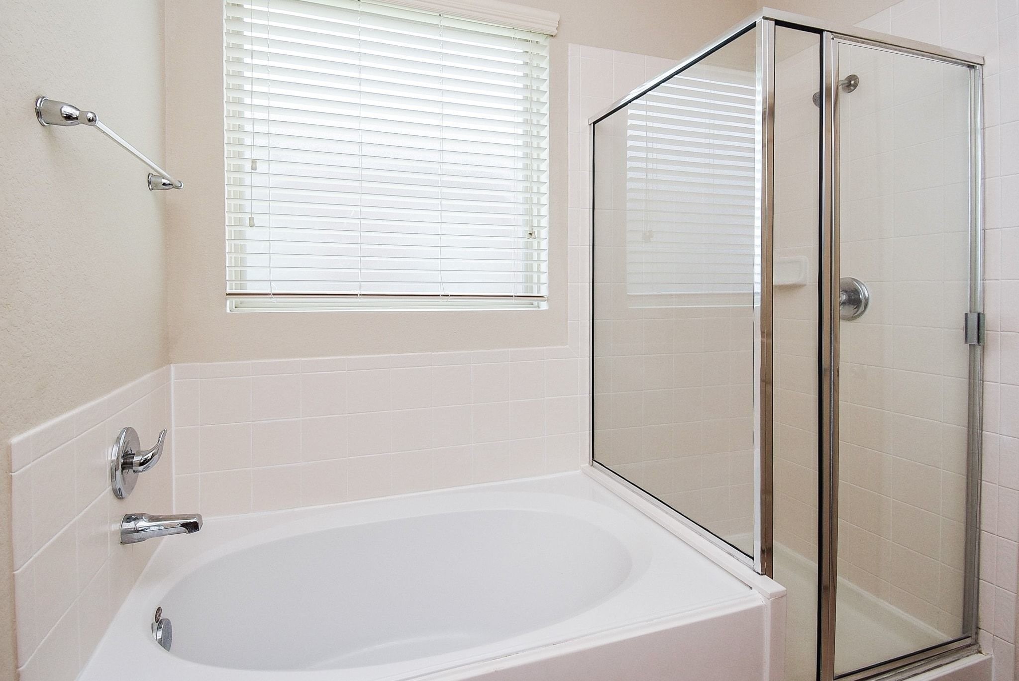 2106 Harmon Crest Court Spring, TX 77373 - Photo 22 of 37 a white bath tub with a shower