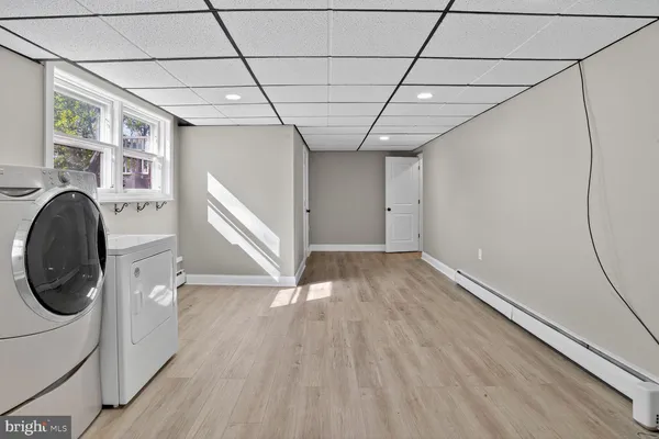 a view of an empty room and wooden floor
