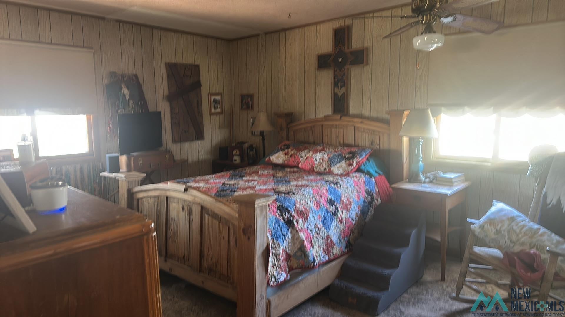 700 Vandiver Road Sedan, NM 88436 - Photo 32 of 32 Bedroom with wood walls