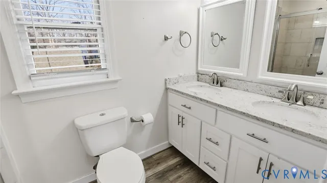a bathroom with a shower and a toilet