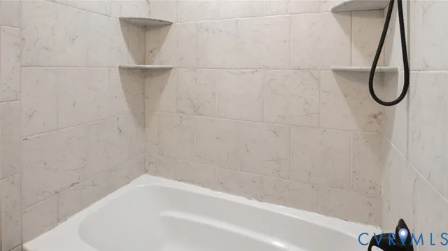 a view of staircase with white walls